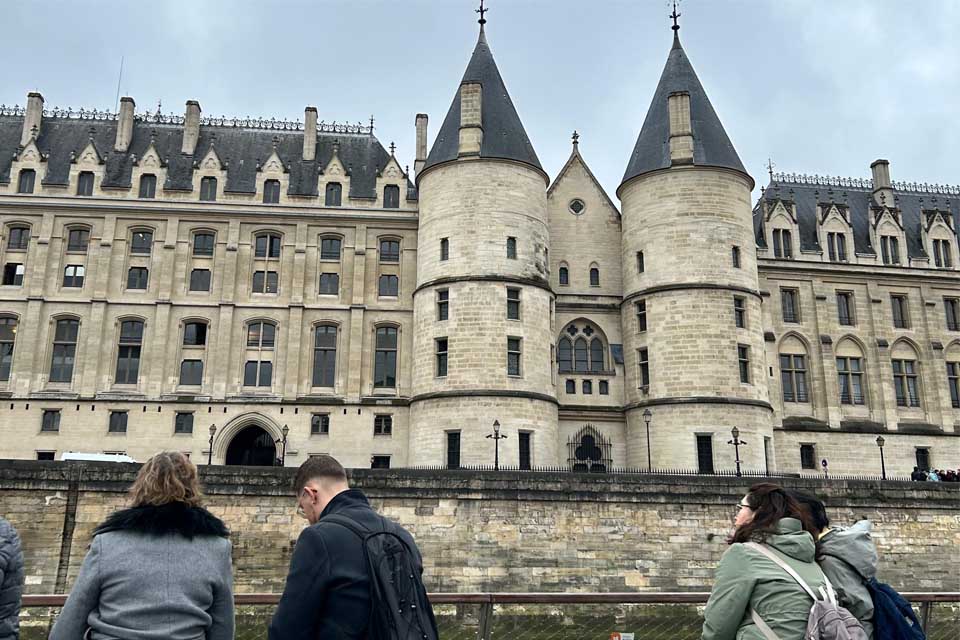 people view conciergerie castle on one hour seine river boat tour